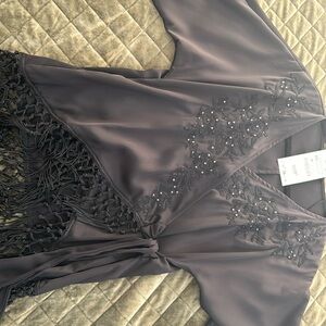 Black blouse with fringe and diamonds